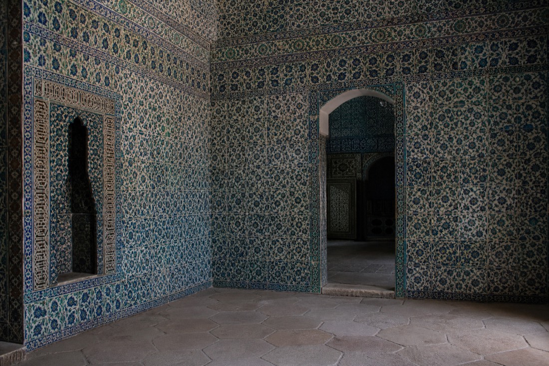 A tiled Harem chamber of Topkapi Palace covered floor to ceiling in Iznik ceramic with an arched doorway
