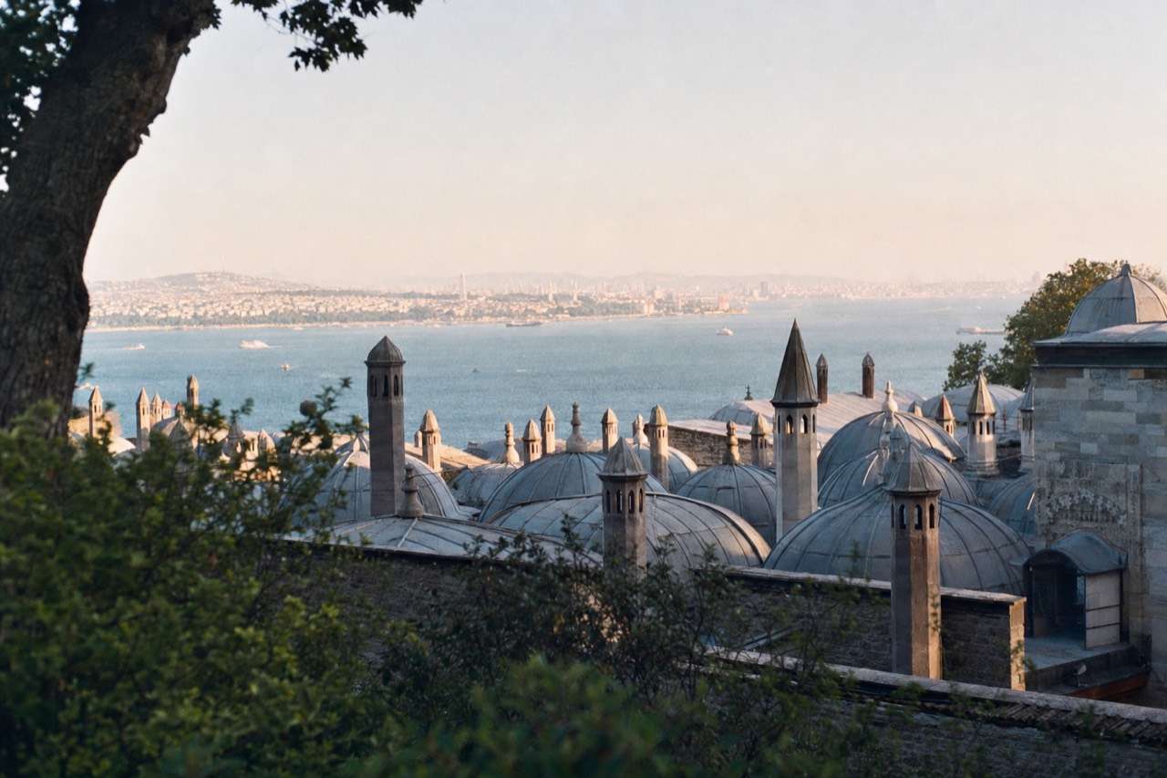 Topkapi Palace rooftops with the domes and chimneys of the palace kitchens against the Bosphorus