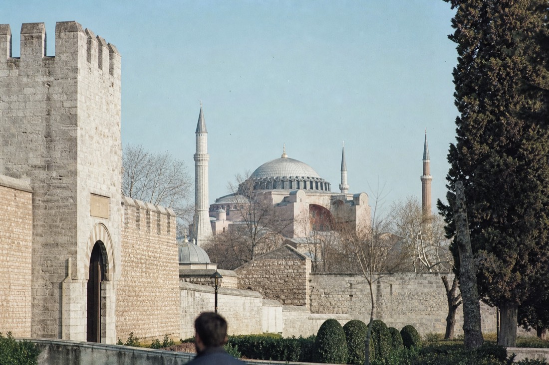 The outer wall and gate of Topkapı Palace with the great dome of Hagia Sophia rising just beyond in Sultanahmet